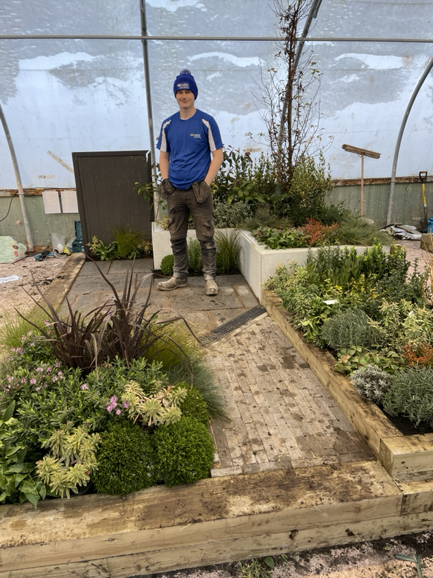 Harry Fitzsimmons from Portaferry proudly displays his Gold Medal winning garden at the WorldSkills UK National Finals in Landscape Gardening held at Oldham College Manchester