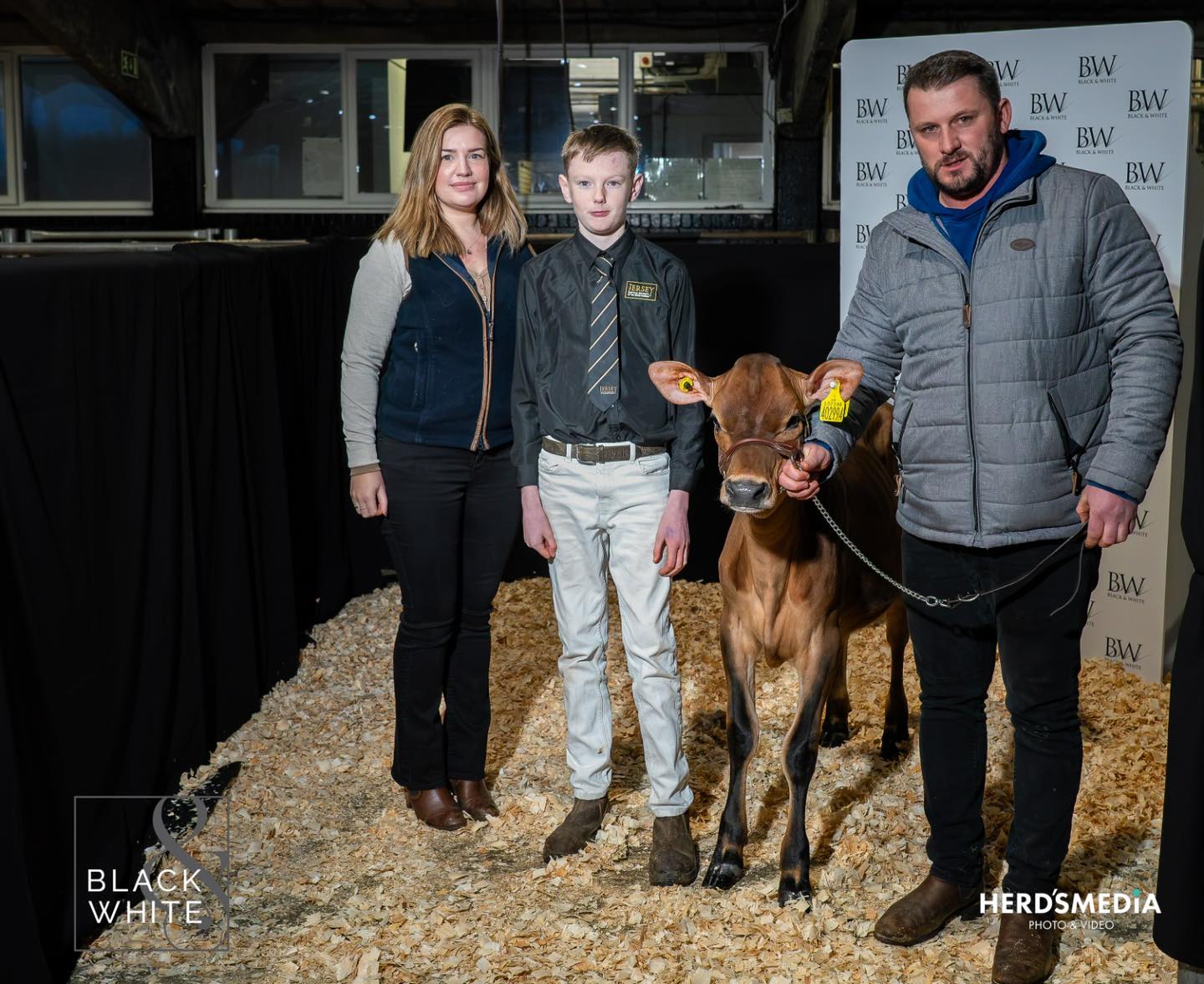 Lizzie Herbert, Tom Baynes and Adam Smith with Royal Flush Genie in a Bottle who sold for 8000gns. Source: Black &amp; White sale Facebook