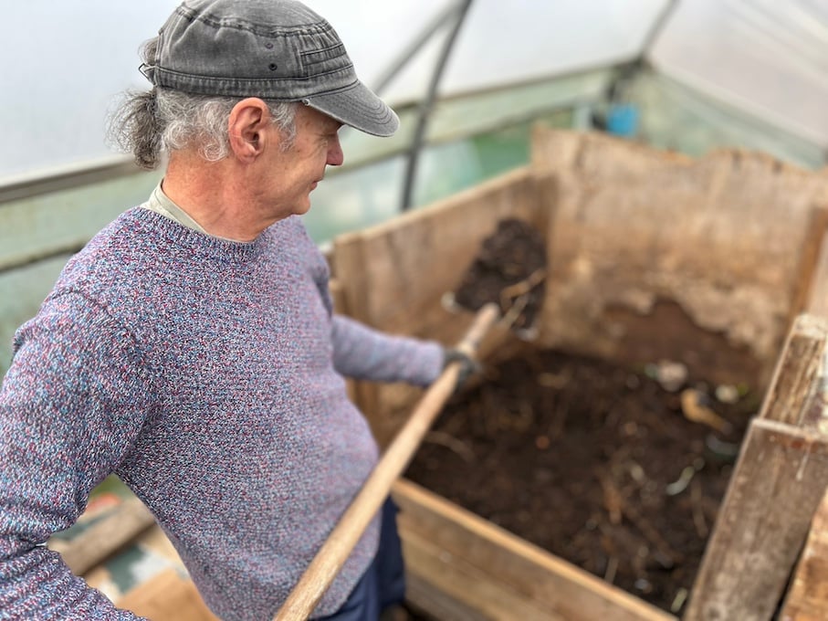 Gareth Boyle, staff at the Organic Centre, composting in the tunnels