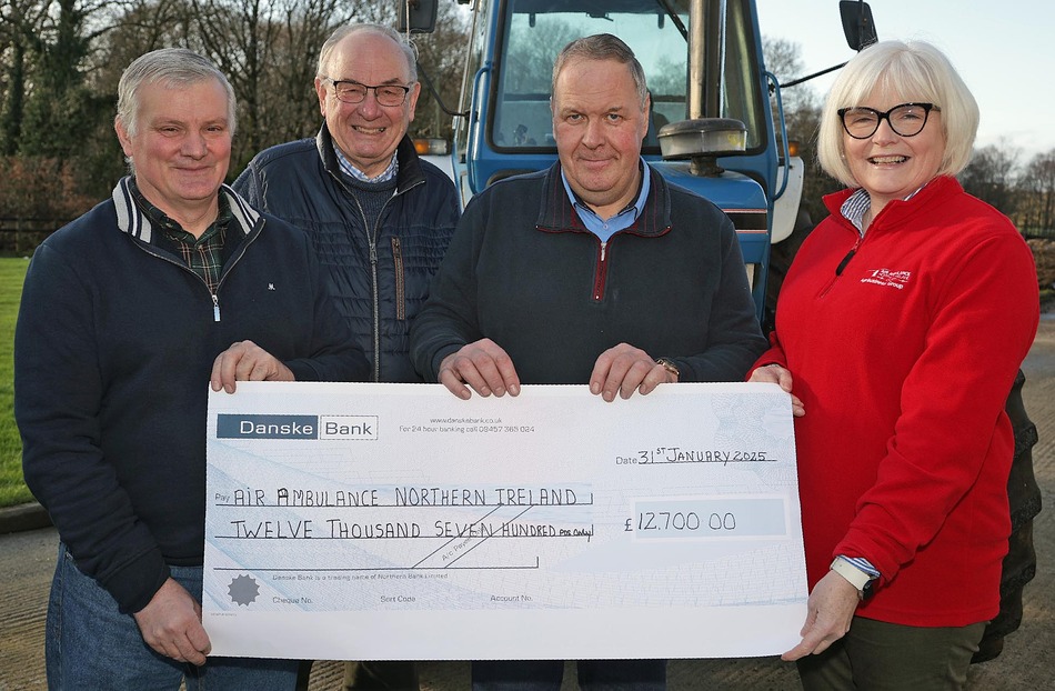 Craig’s Tractor Enthusiasts Club founder Robert McCaughey (centre) and club members pictured with Oonagh Chesney, Air Ambulance NI representative