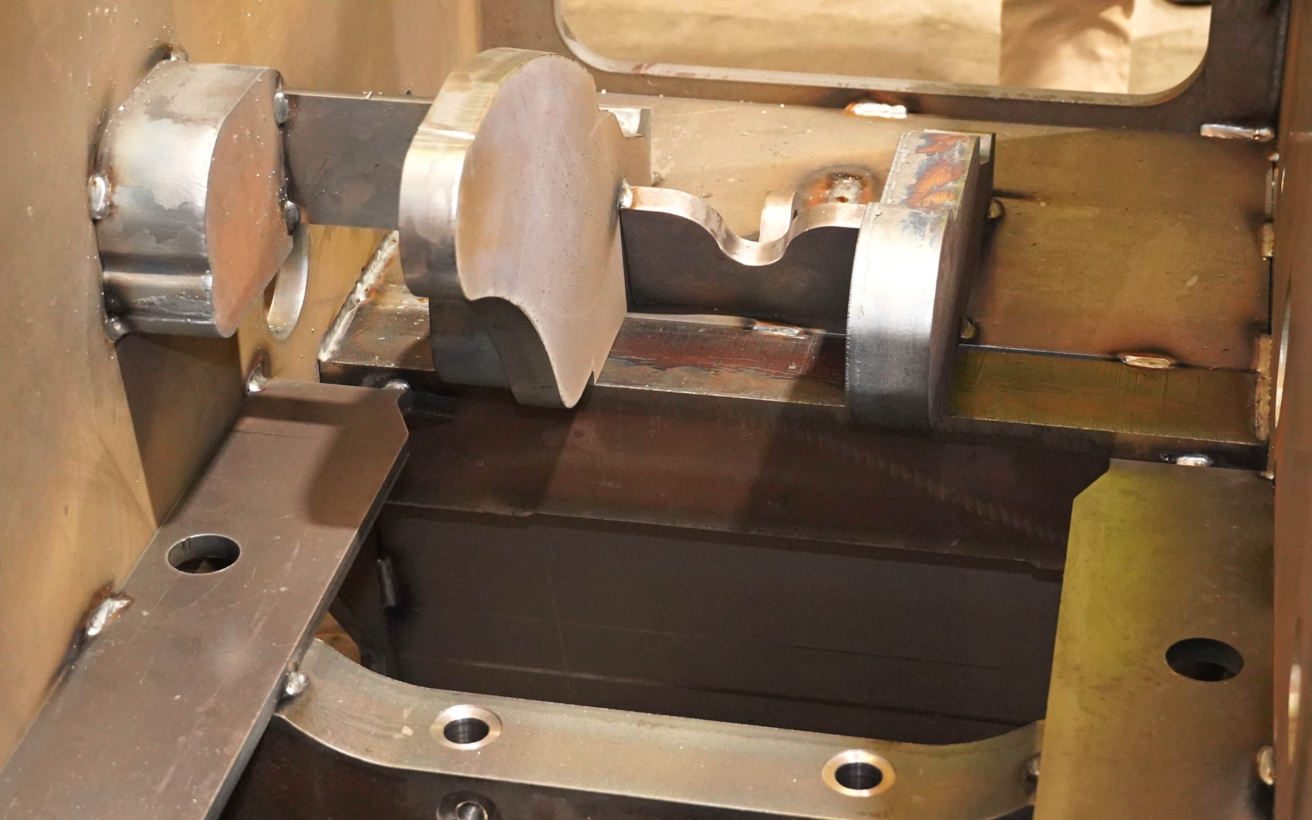 The mainframe is tack welded in a jig before being finished by a robot