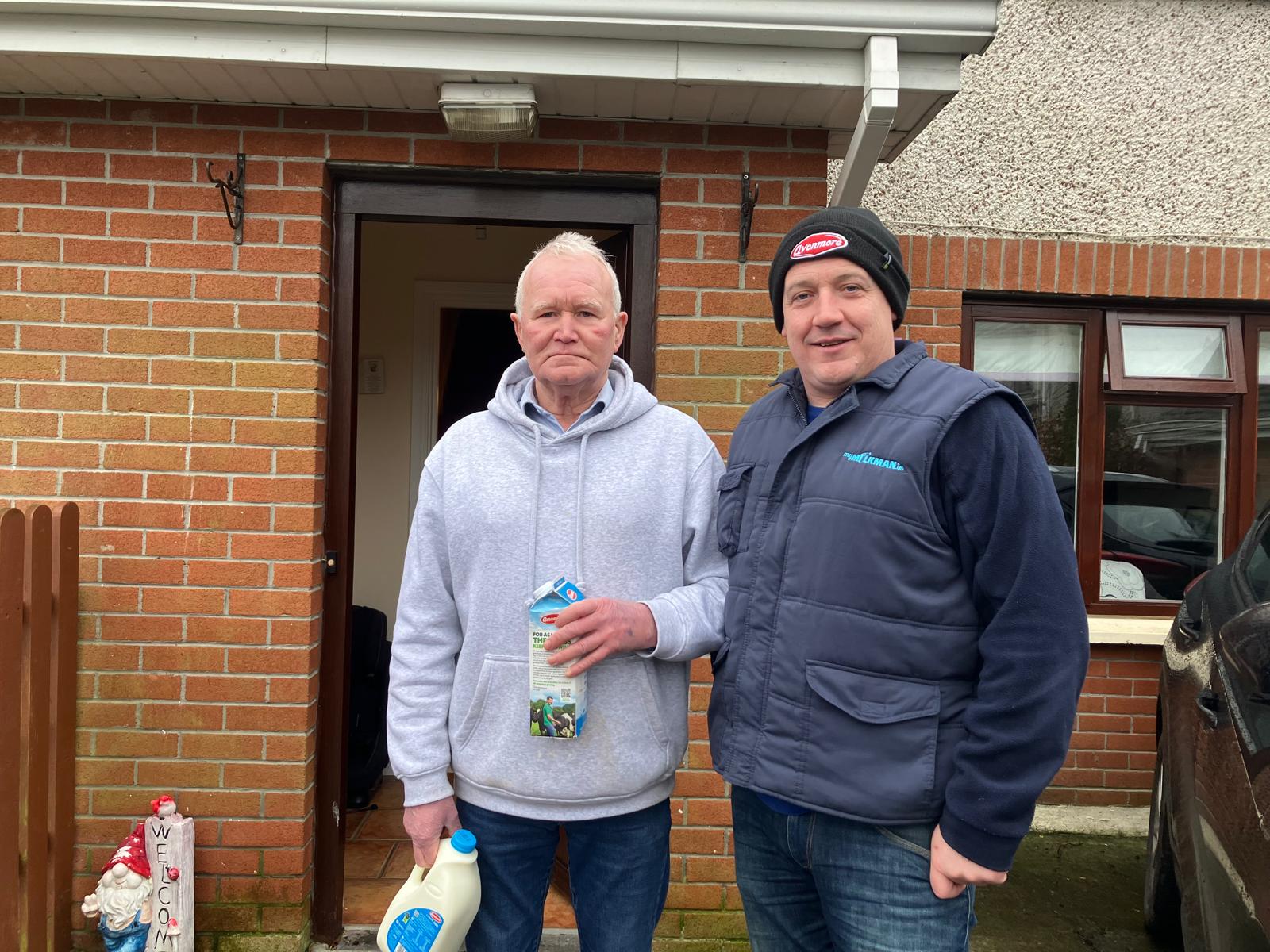 Customer Joe Corrigan and milkman Clive Ledwith