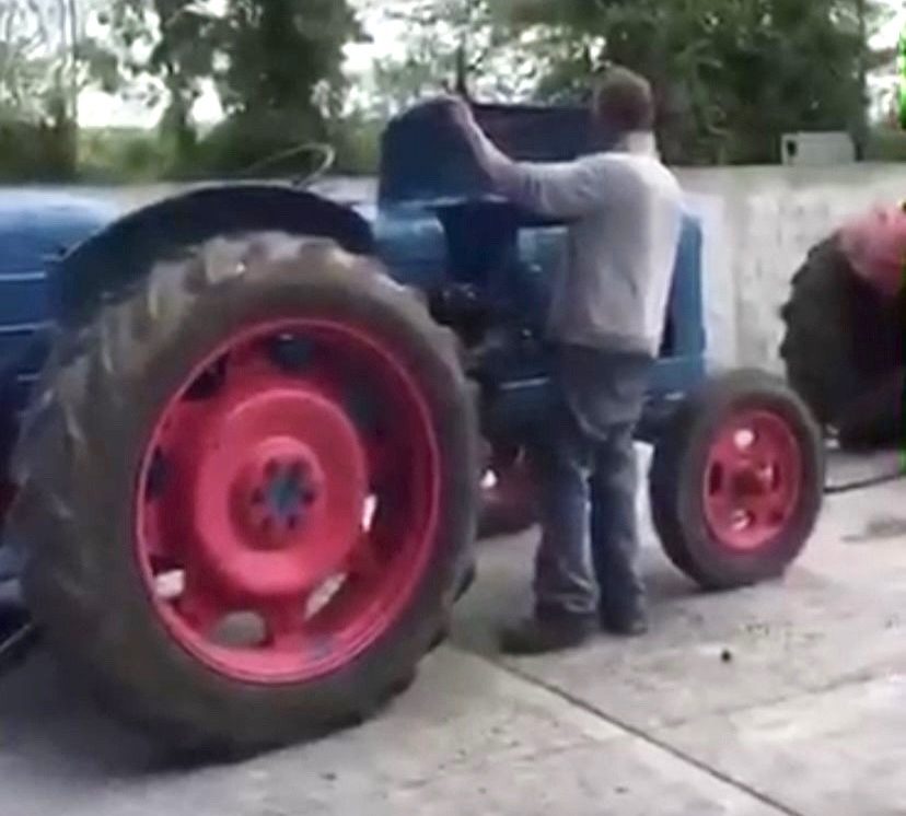 The late Mick Kelly at work on his tractor.