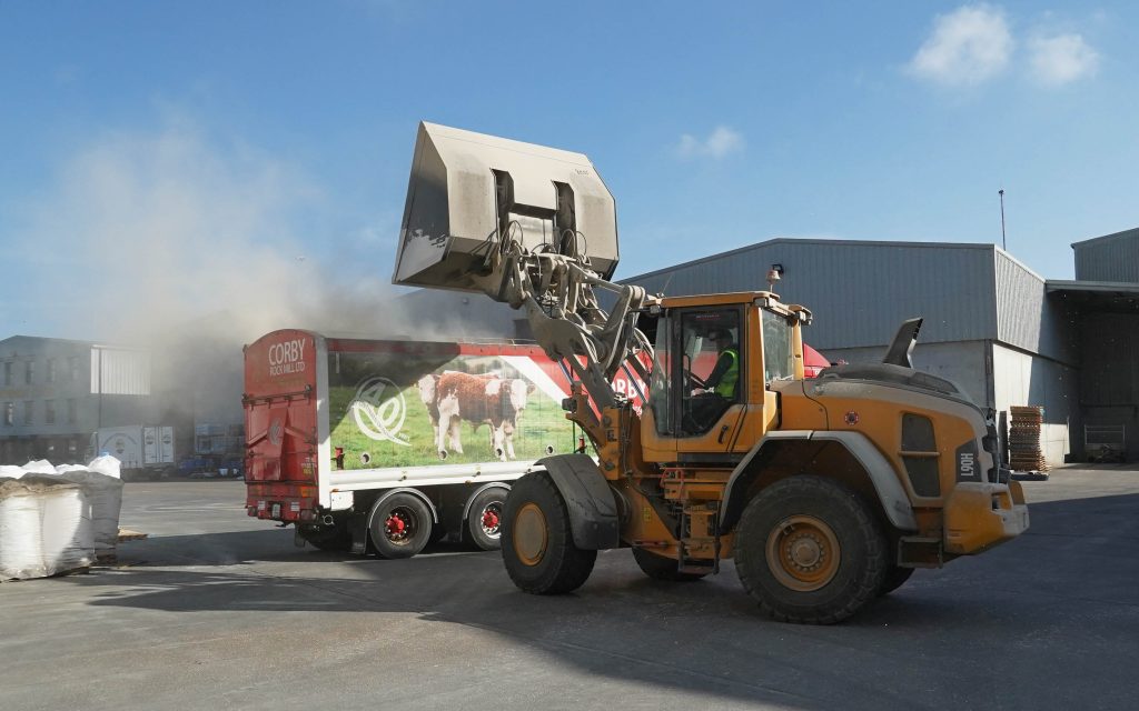 A truck is loaded with feed barley stored at Deeside's Dunleer base