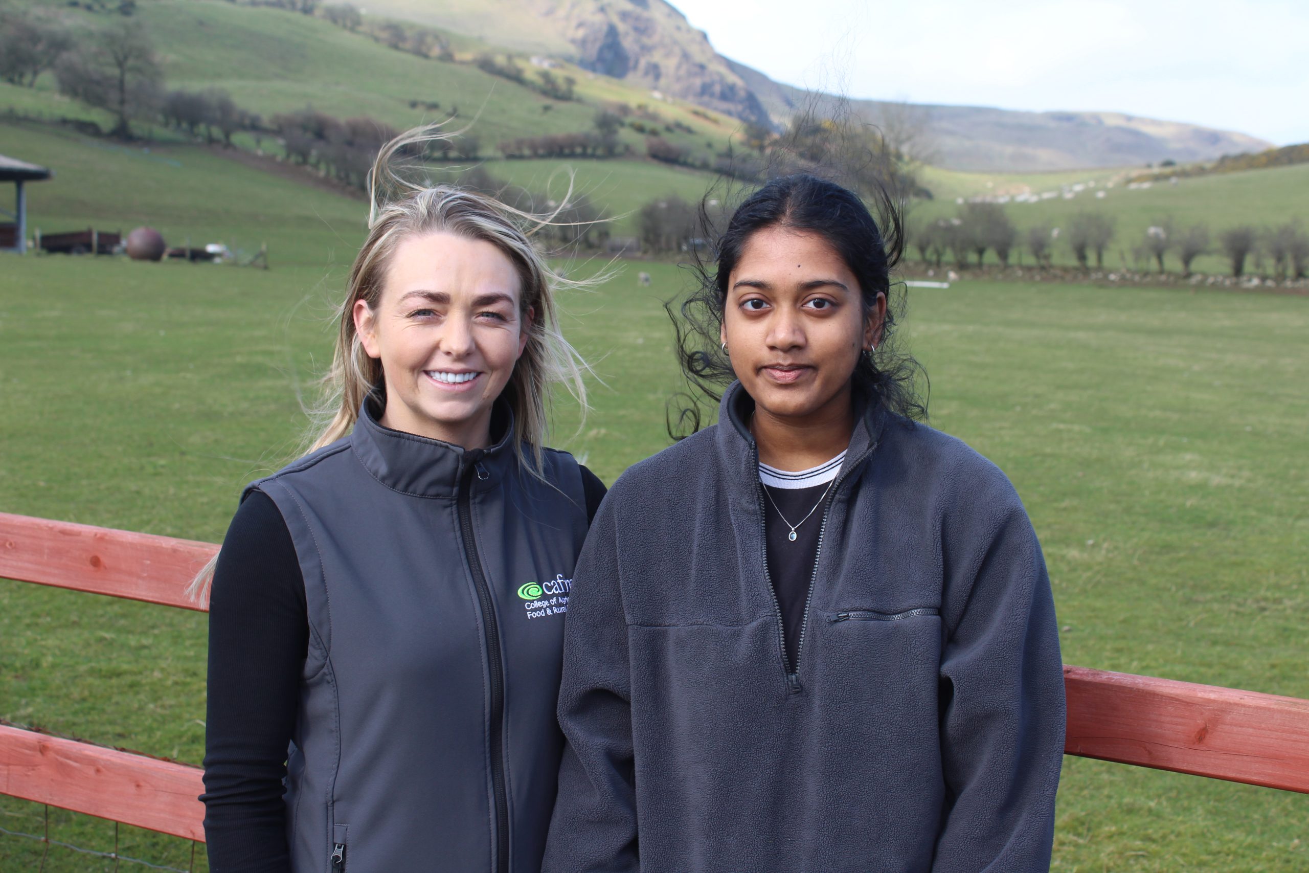 Visiting the Co. Antrim sheep farm of Campbell Tweed, CAFRE lecturer, Carrie Smith (left) and agricultural technology student, Idhaya Mahimairaj