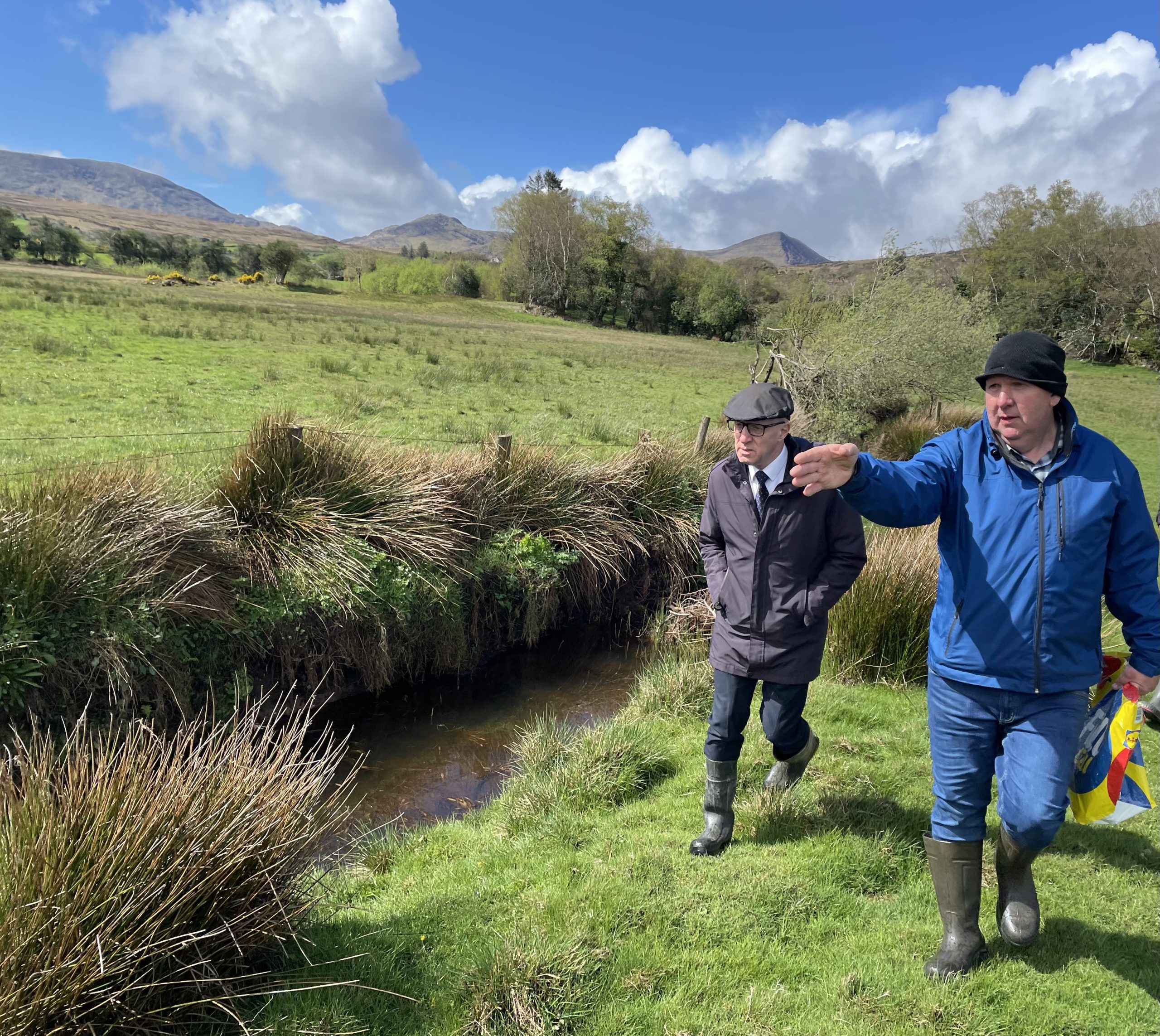 Farmer William Murphy showing Minister of State Michael Healy-Rae the drains on his lands