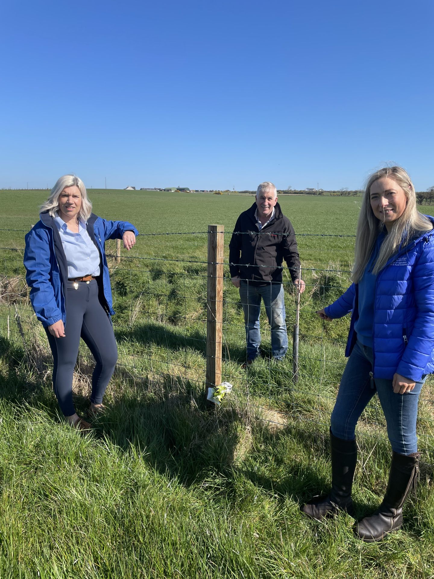 CAFRE beef and sheep advisers Rachel Megarrell and Faith Stewart discuss the use of riparian strips to protect watercourses on the farm of Victor Chestnutt.