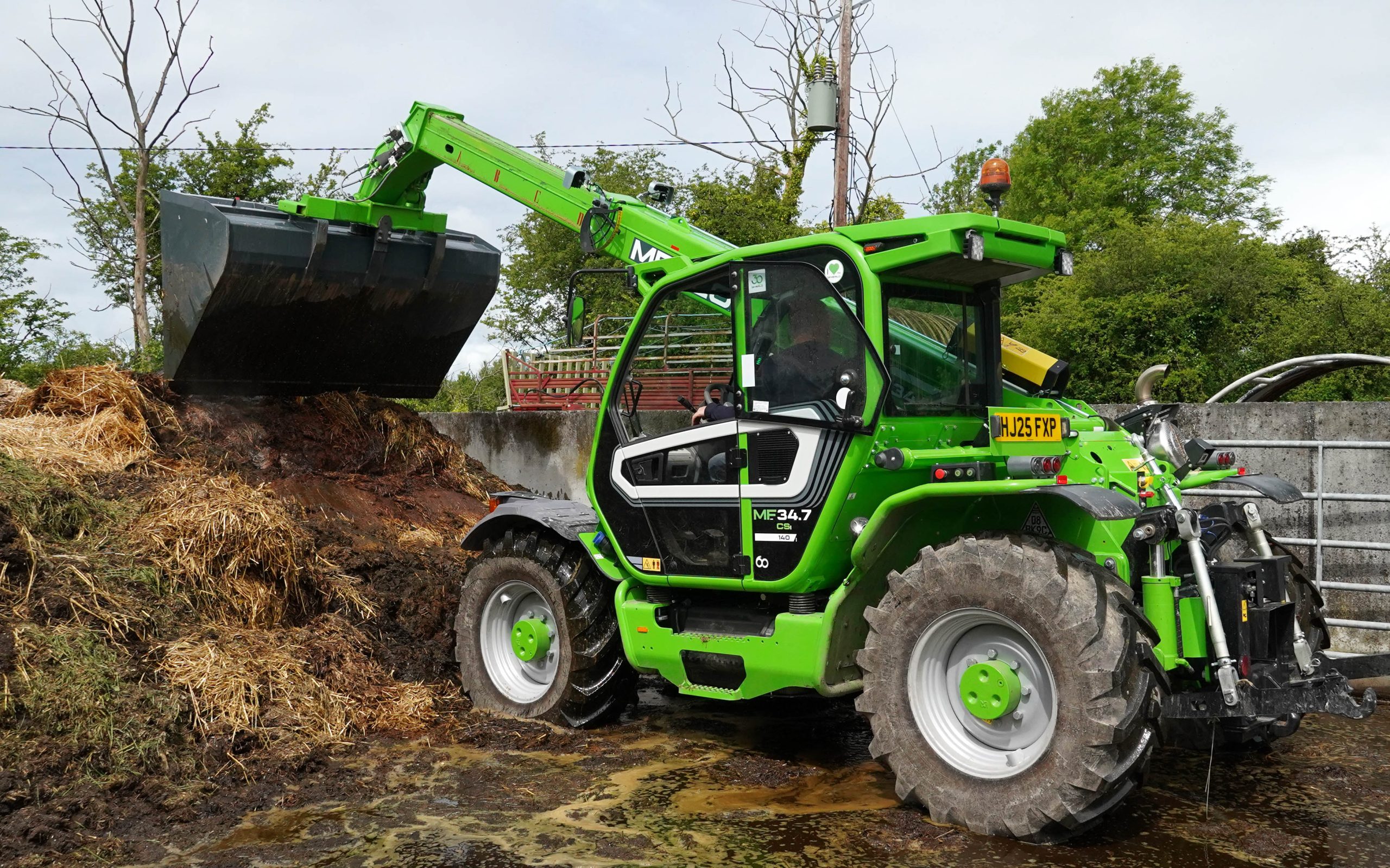 Although fitted with a three-point linkage, the Multifarmer is used mainly for loader work such as pushing up the muck heap