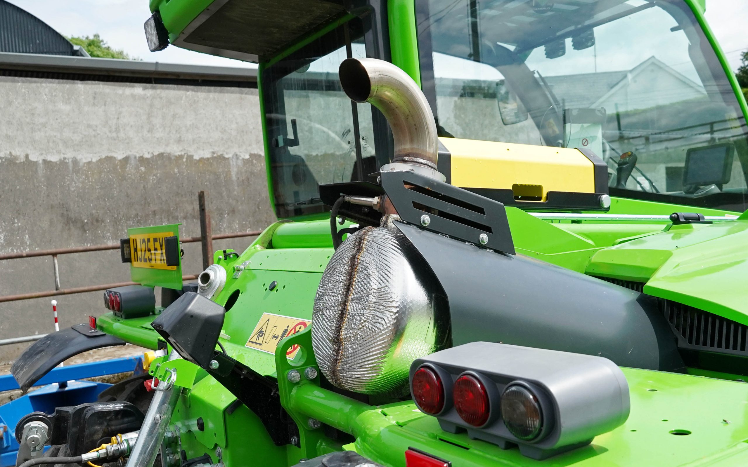 There is no clear pathway for a mower release cord  into the rear of the cab.