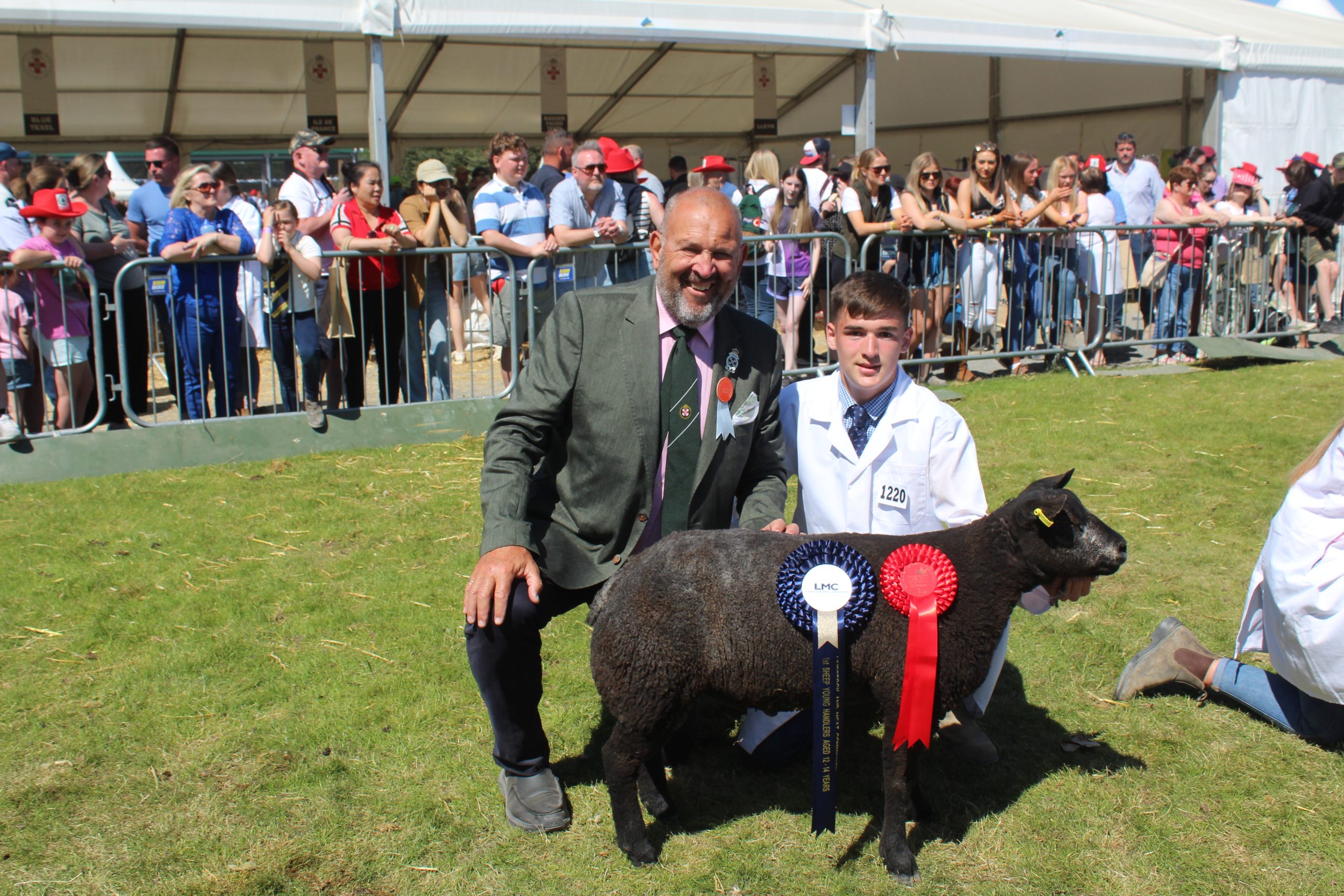 Jake Piggot, from Killinchy Co. Down, was the Sheep Young Hander Champion at Balmoral Show 2025. He was congratulated by LMC board member, David Mark