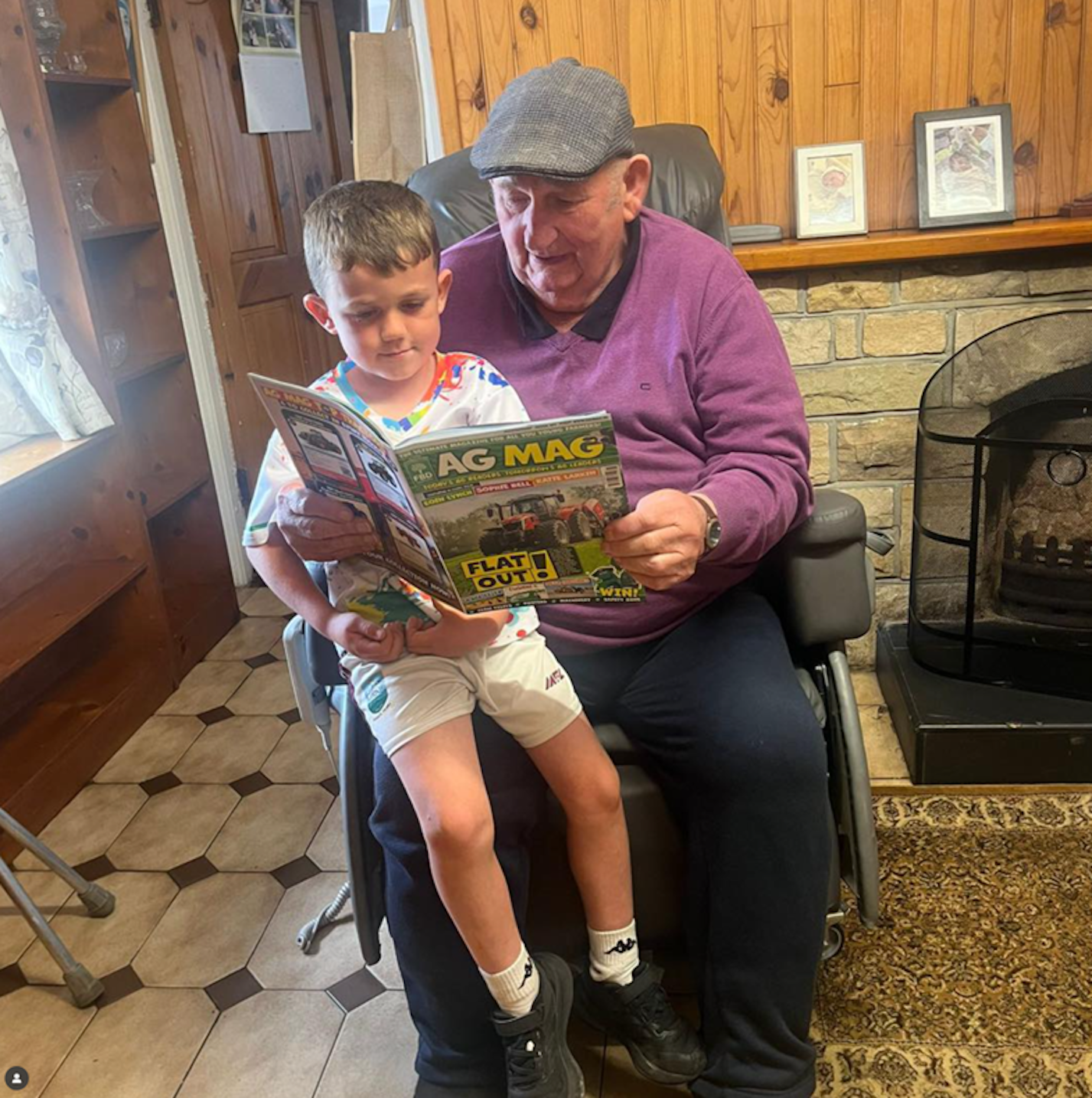 Seán Gallagher, aged 5, with his grandad and farmer Liam Duignan, from Aughamore, Co. Leitrim, perusing the magazine