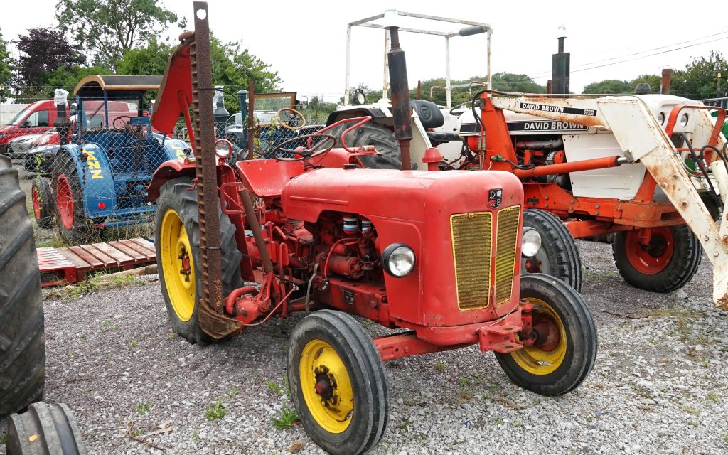 TDB 750 comes complete with side mounted mower, a later DB 1212 stands behind it