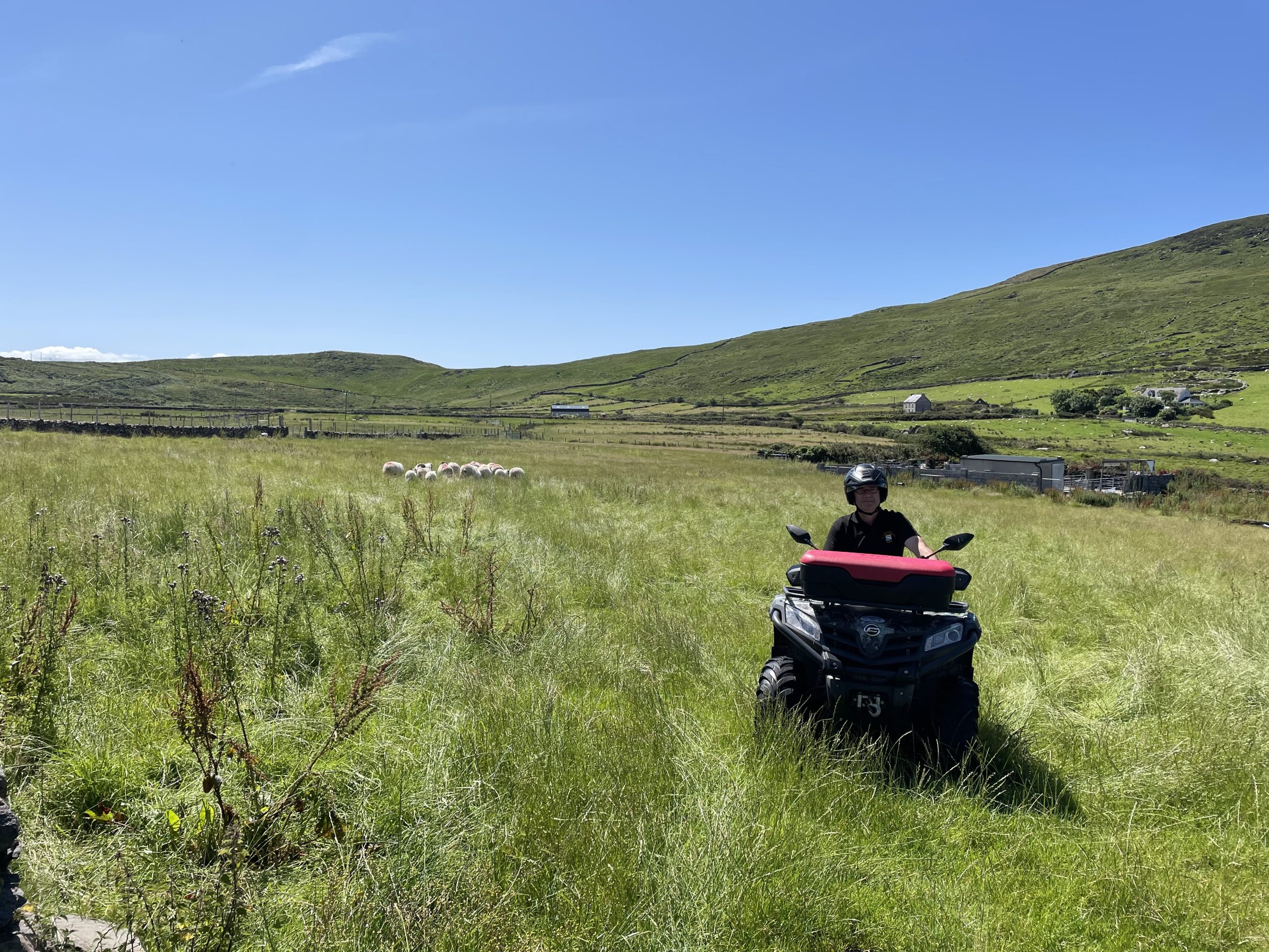 John Joe Fitzgearld riding his quad on his farm