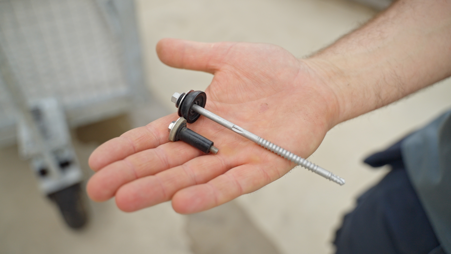 Tech screws with rubber seal to allow roof panels to move under stress.