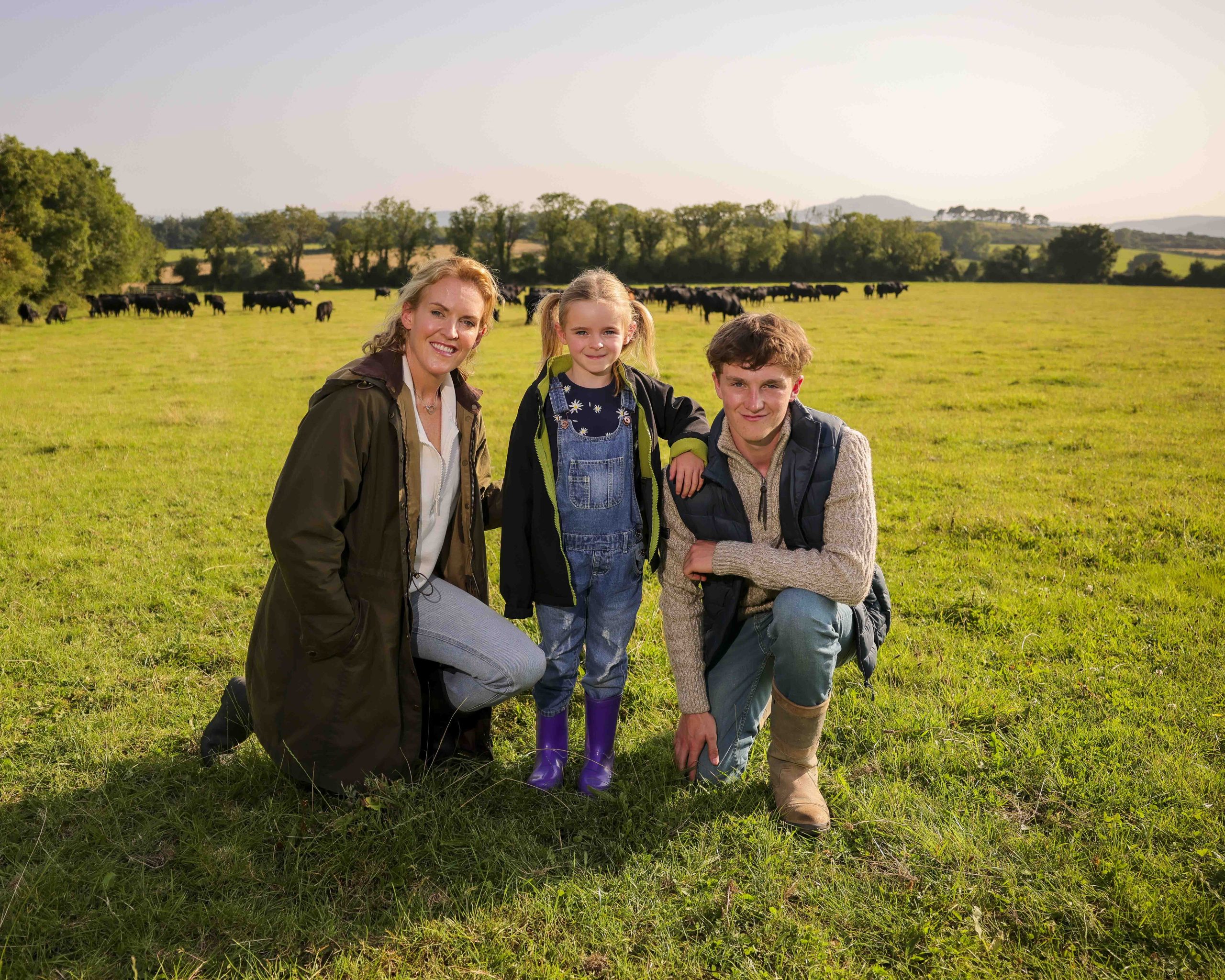 Wicklow beef farmer Rebecca Harris of Ballyhenry Farm, her daughter Skye and nephew Harvey, alongside their herd of organic Aberdeen Angus cattle Image: Chris Bellew