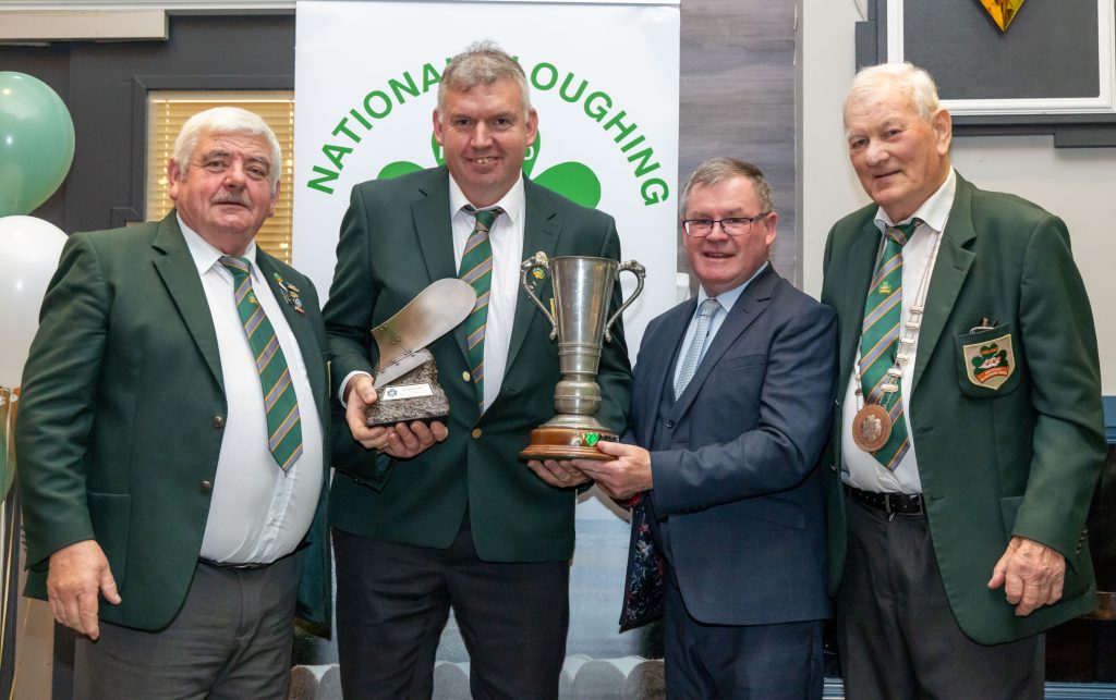 John Whelan from Wexford, winner of the Reversible Senior competition is presented with the Bill Kenneflick Perpetual Trophy, NPA Trophy and gold medal by NPA chairman John Deery, Sean O’Brien, leas cathaoirleach of Offaly County Council and NPA president Mick Mahon. Image: Alf Harvey