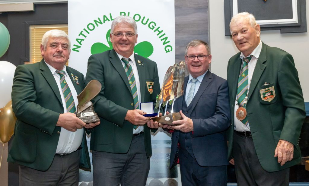 Eamonn Tracey from Carlow, winner of the Conventional senior competition is presented with the Esso Supreme trophy, NPA Trophy and gold medal by NPA chairman John Deery, Sean O’Brien, leas cathaoirleach of Offaly County Council and NPA president Mick Mahon at the Ploughing 2025 awards in Tullamore. Image: Alf Harvey