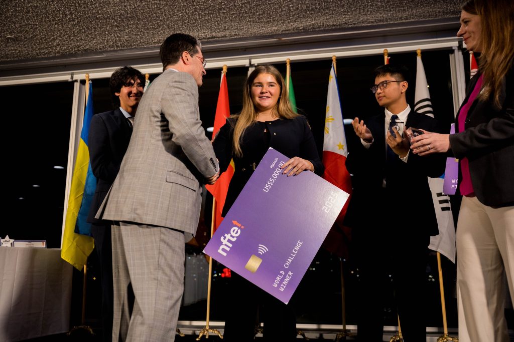 Carla being presented with her prize