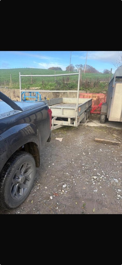 A front image of the missing steel Porter triple axle 16x7ft flatbed trailer. Source: Police Fermanagh &amp; Omagh's Facebook
