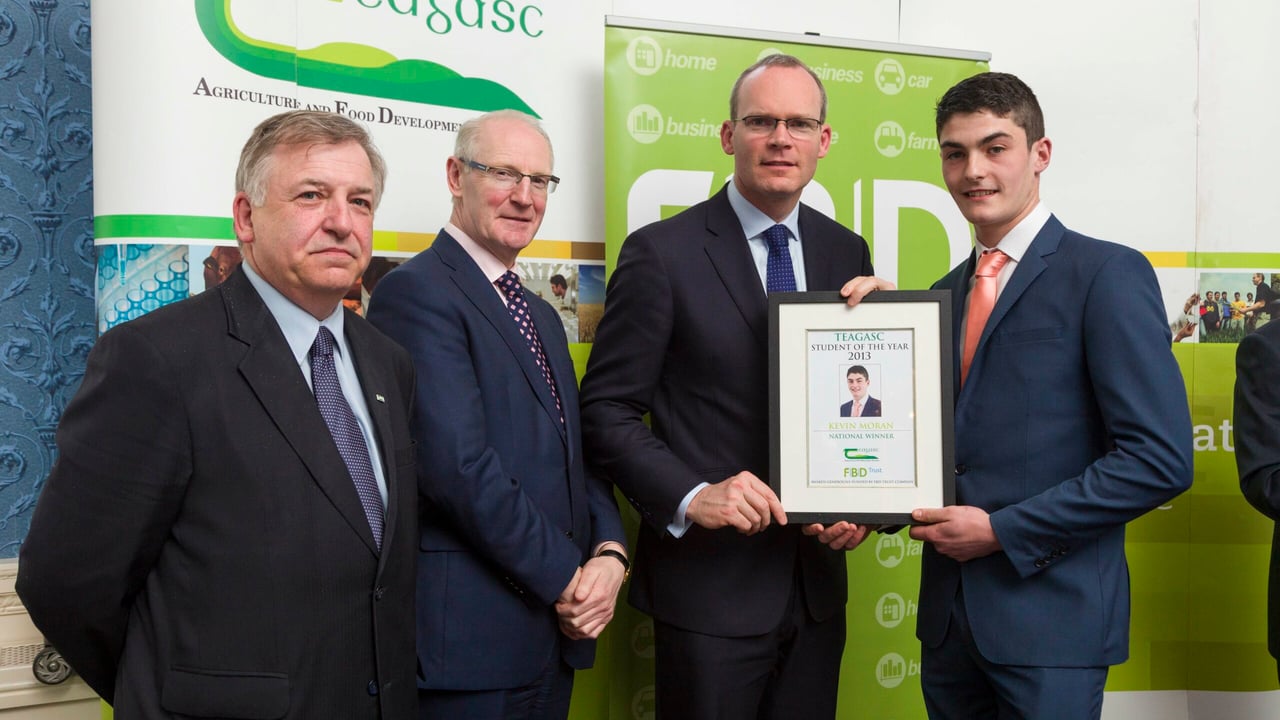 Prof. Gerry Boyle, Director Teagasc with Michael Garvey, Director Of Marketing And Sales FBD, and Minister for Agriculture, Food & the Marine Simon Coveney,  present Kevin Moran, Shessagh, Taugheen, Claremorris, Co. Mayo, with the Teagasc/FBD Student of the Year award. 
