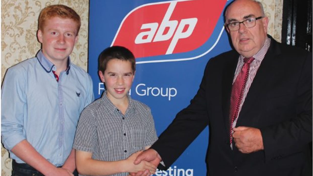 Owen Mc Creevey and Caleb Haffrey with Liam McCarthy from ABP.