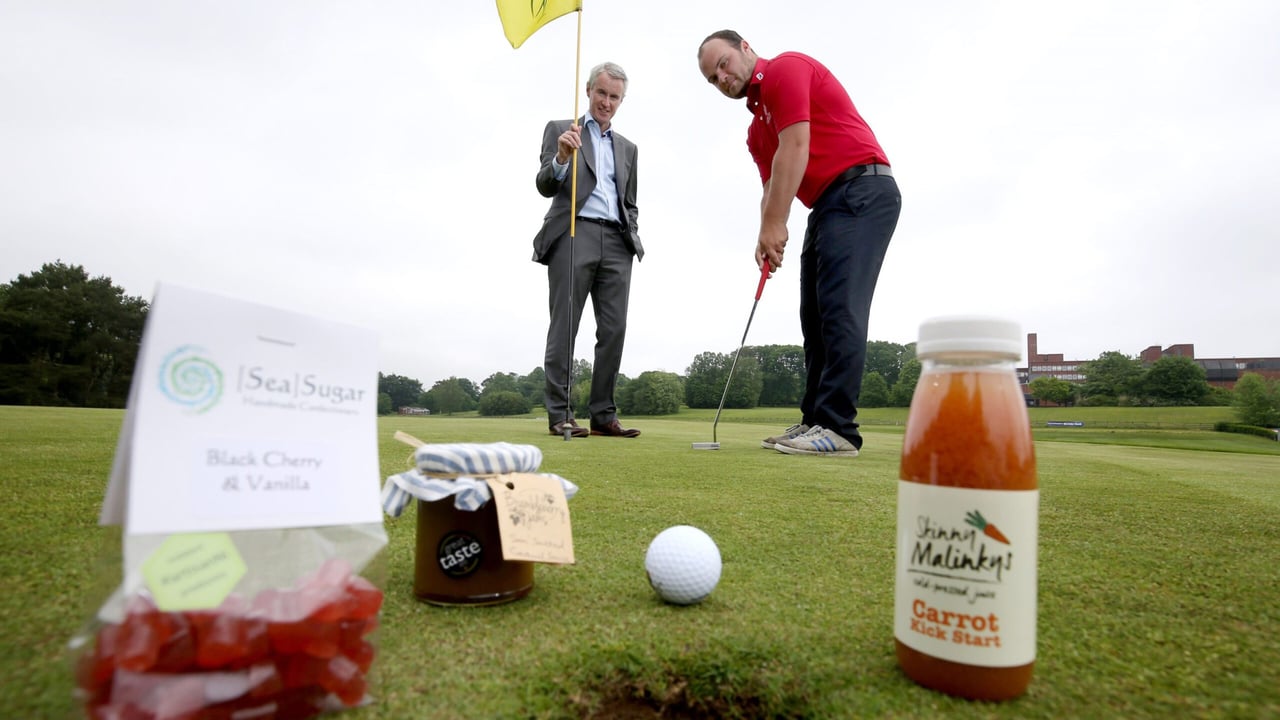 Terry Robb (left) Ulster Bank Regional Manager, Private Banking and up and coming young golfer Jordan Hood from Galgorm. 