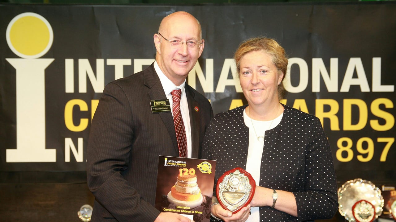 Ian Luxton, Vice Chairman, International Cheese Awards presents the trophy for the Champion Convenience Cheese to Linda Tanner