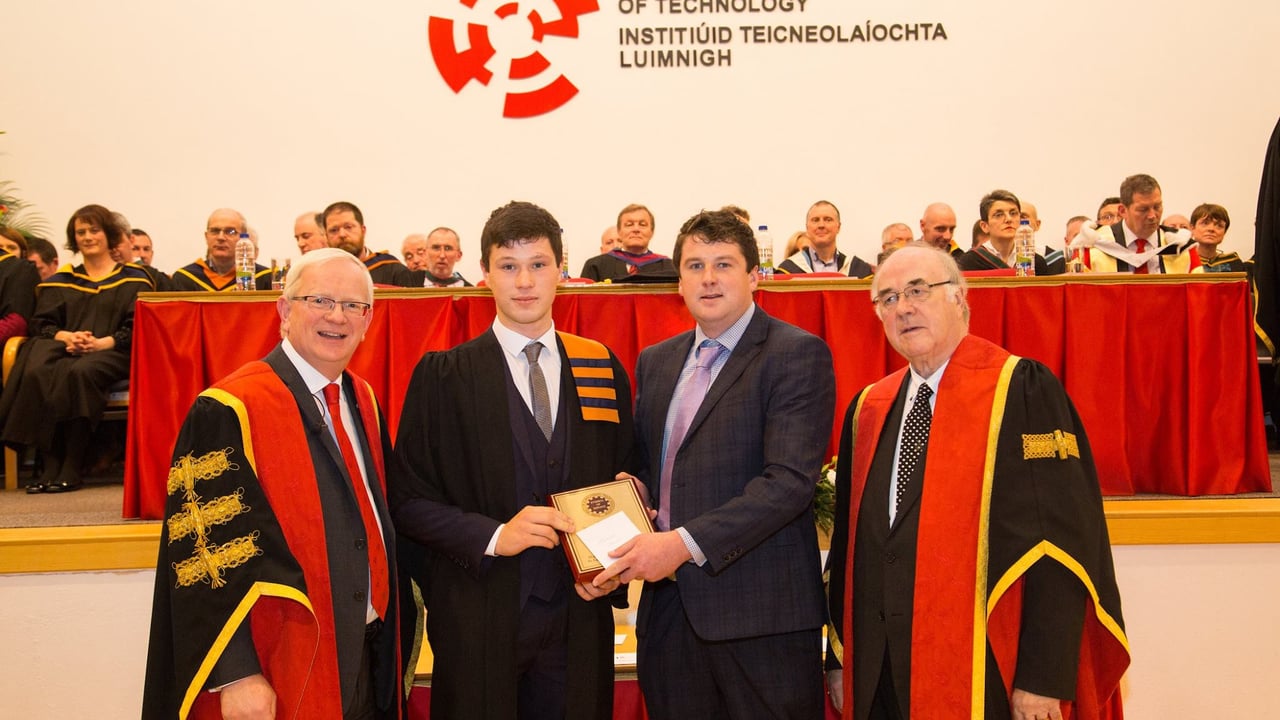 Thomas Dunne receives his award, presented by Conor McGuinness of the FTMTA. Image source: LIT Facebook page