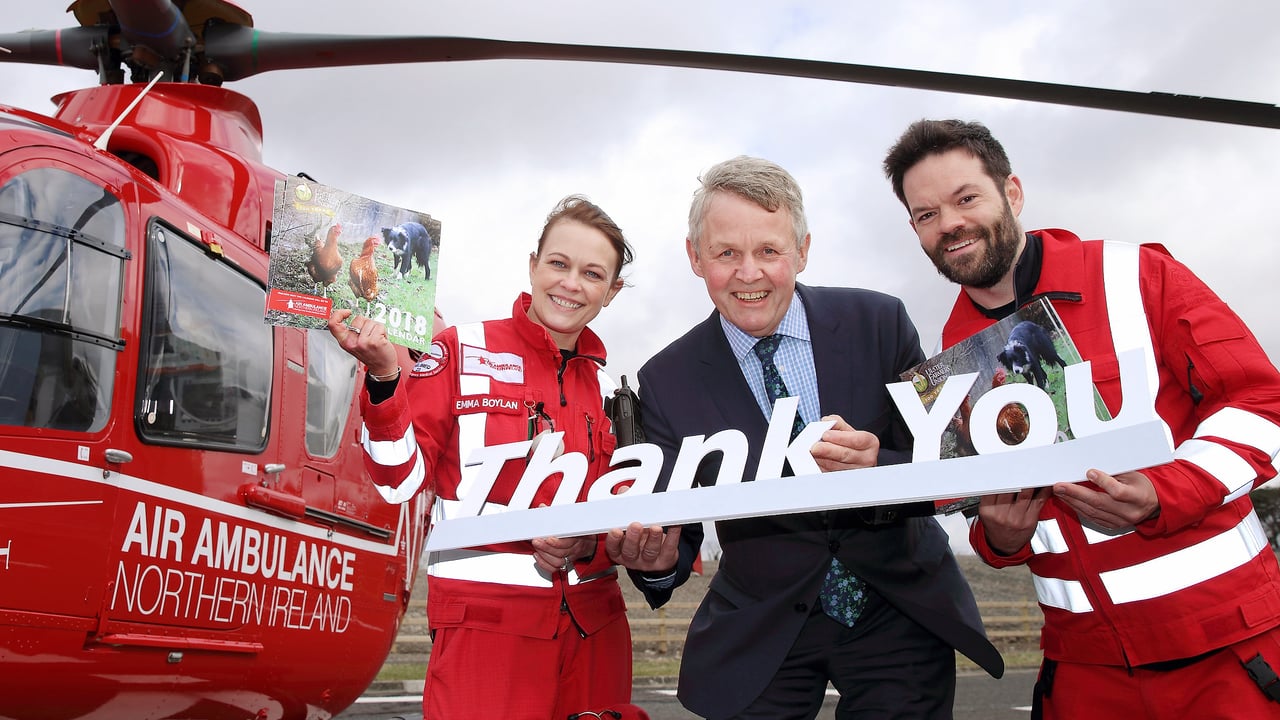 UFU president Barclay Bell with air ambulance crew members, paramedic Emma Dolan and doctor Rory Maguire