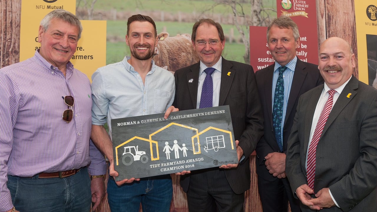 Tidy Farmyard winners Gareth and Norman Kee with representatives of the UFU and NFU Mutual