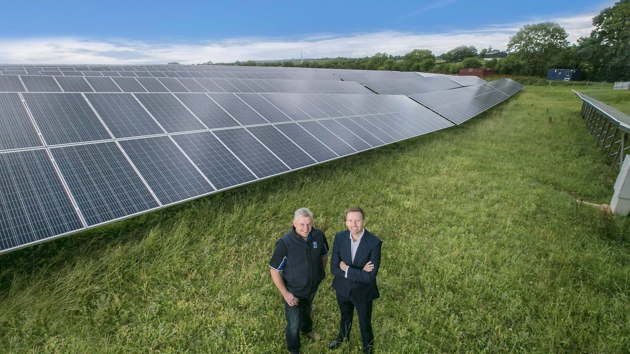 L-R: Chris McAlinden, group operations director at Dale Farm, alongside David Beggs, one of the co-op's milk suppliers. Image Source: Brian Morrison