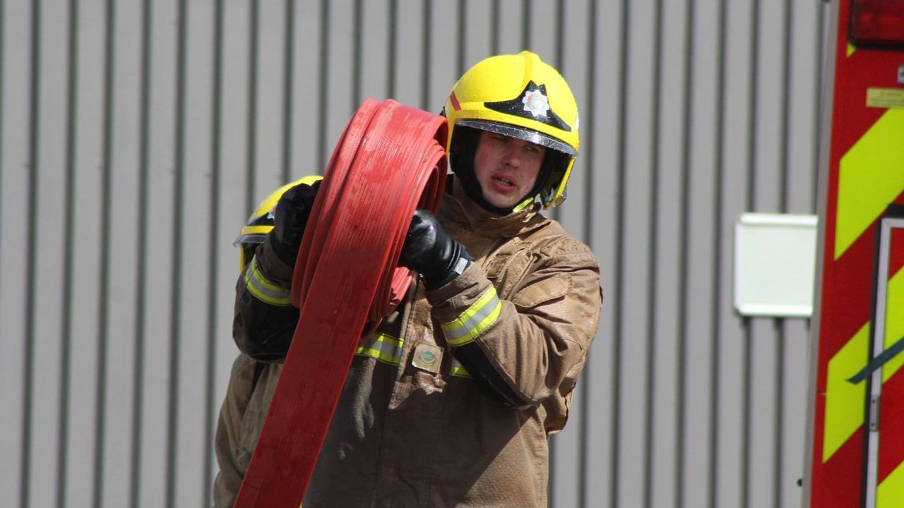 Firefighters douse tractor 'well alight in a field'