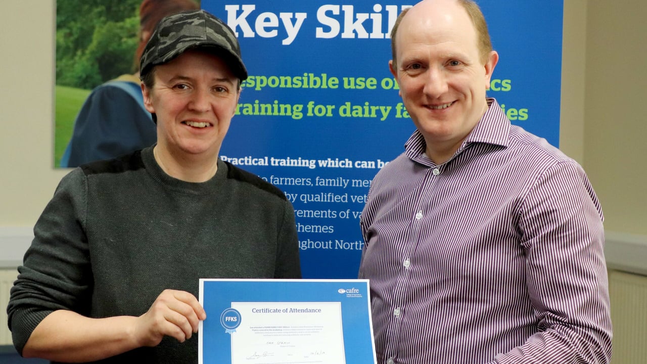 Verna Ramsey from Magherafelt receiving her certificate from Sam Strain, chief executive of AHWNI, at the workshop held at Cookstown