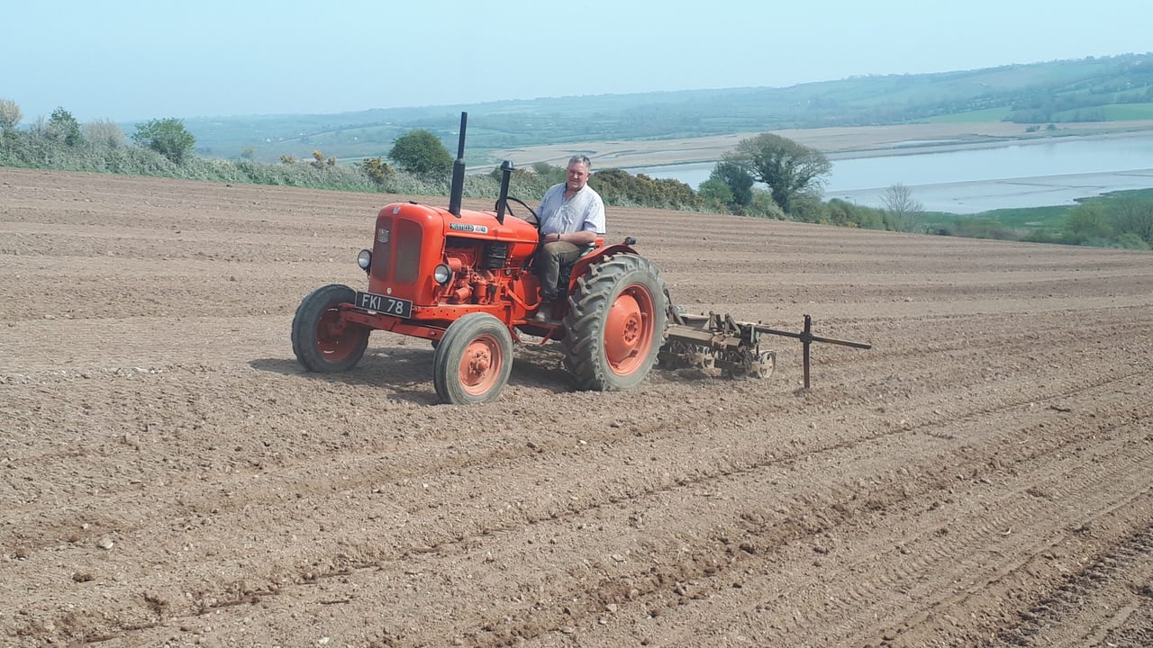 Joe O'Neill, pictured on his Nuffield tractor, of Knockanore, Co.Waterford, was sowing beet during the dry spell. In the background is the Blackwater river