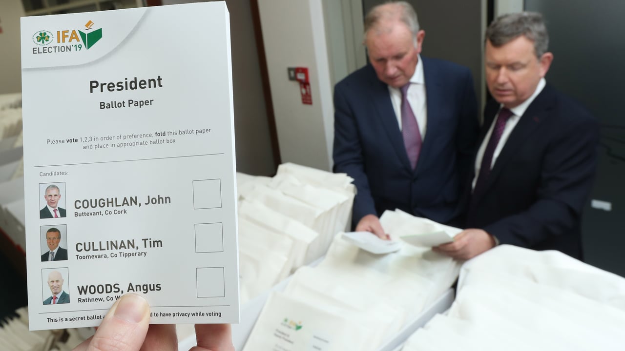 Richard Kennedy and Bryan Barry supervise the distribution of ballot papers. Image source: Finbarr O'Rourke