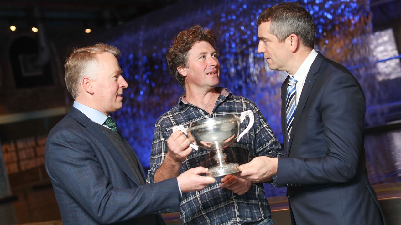 Pictured with the Guinness Perpetual Cup for Malting Barley Excellence from Boortmalt and Diageo Ireland is Carlow’s Evan McDonnell after growing the best malting barley this year. With him are Charles Tozer, Boortmalt, (on right) and  Aidan Crowe, Operations Director St. James’s Gate Brewery. Image source: Naoise Culhane