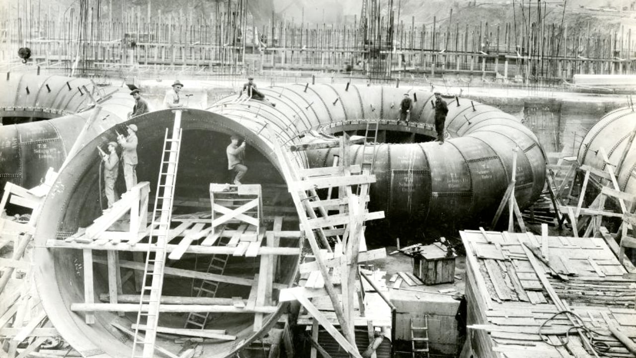 ESB Archives PG.SS.PH.325.26, Close up of workers working on turbine II at Ardnacrusha Power Station, 18 June 1928. Image source www.esbarchives.ie
