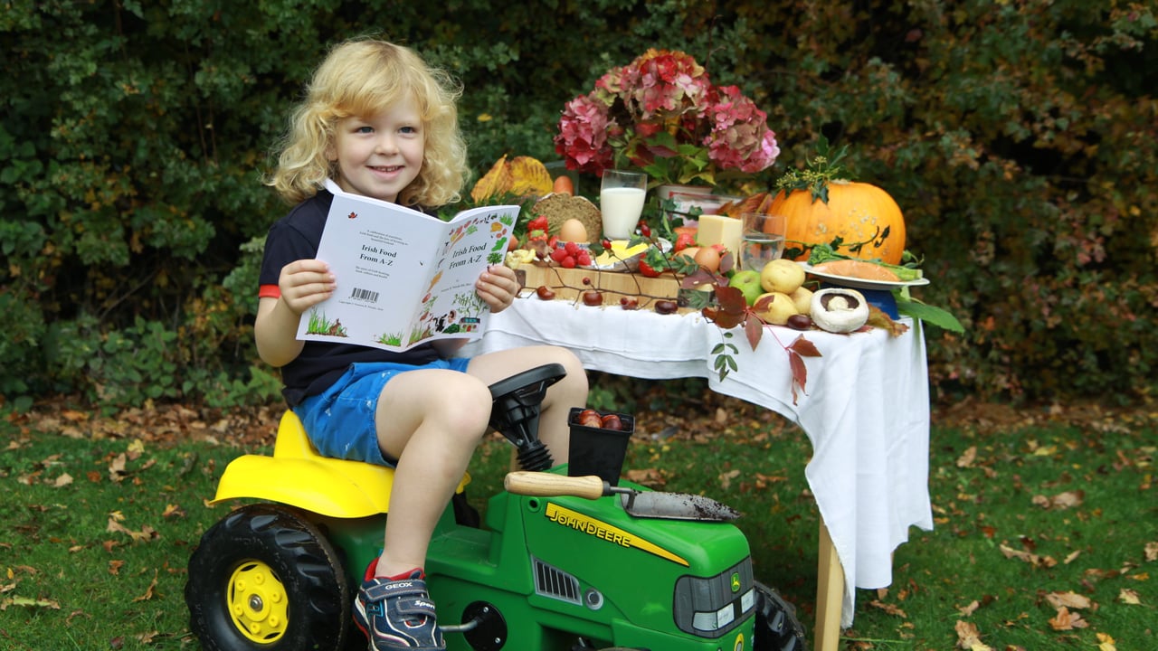 Three-year-old Theo Chiswick  from Castleknock, Dublin, takes a flick through the book