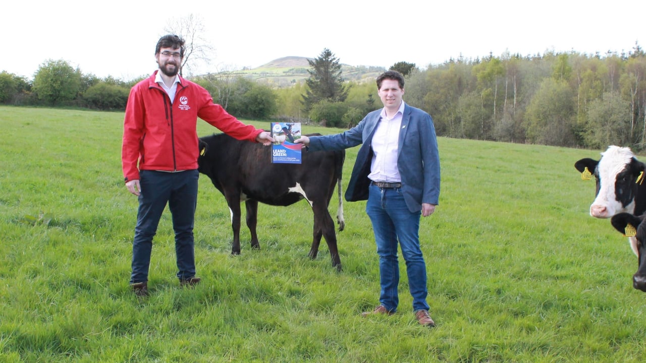 Macra president Thomas Duffy presenting the document to Matt Carthy, Sinn Fein agriculture spokesperon