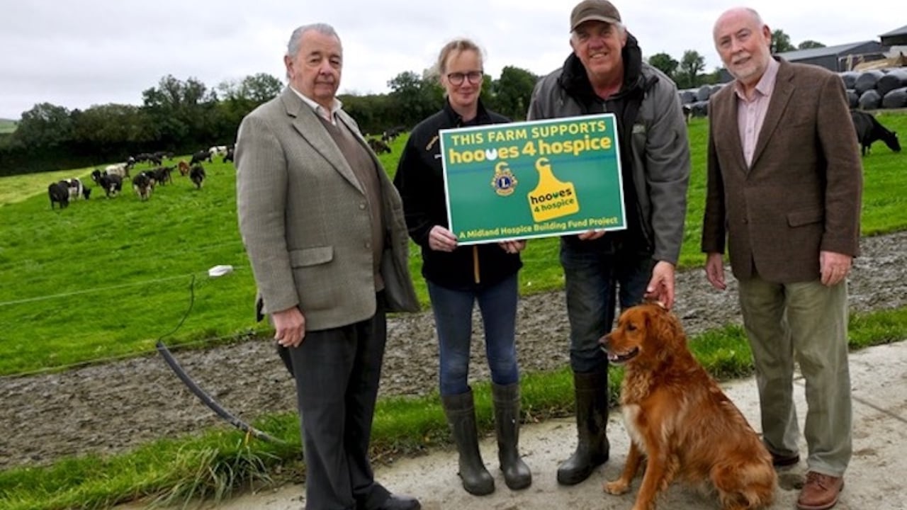 Tullamore Lions Club members Tom Maher and John Lyons with Eoin and  Colette Toohey and  their dog Roxy