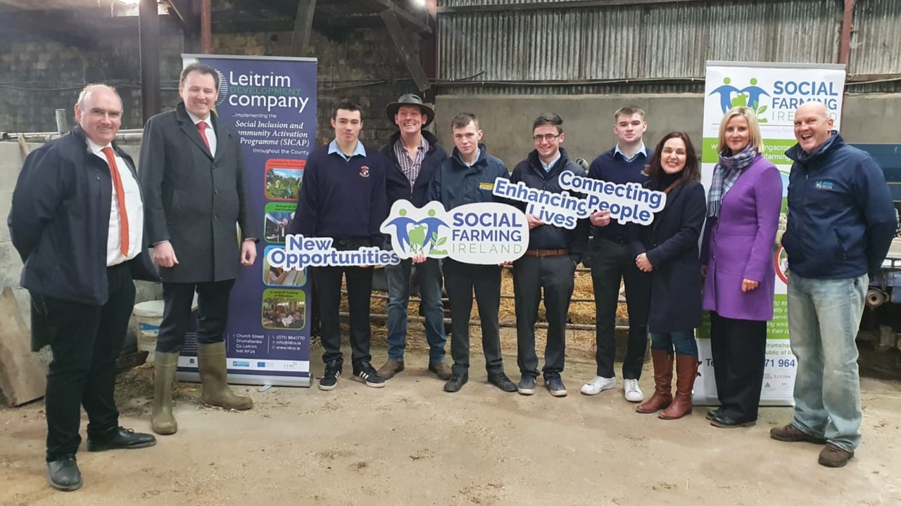 Minister McConalogue with social farmer William McLaughlin, staff from Social Farming Ireland and staff and Leaving Cert Applied students from Carndonagh Community School