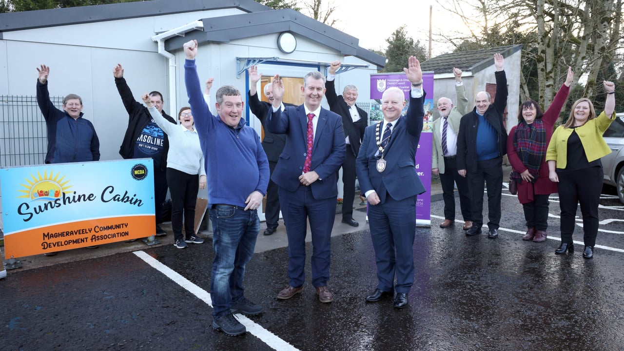 Minister Edwin Poots (centre) with MCDA chair Les Graydon (l) and Co. Fermanagh and Omagh Council chair Cllr Errol Thompson (r) and FOLAG members
