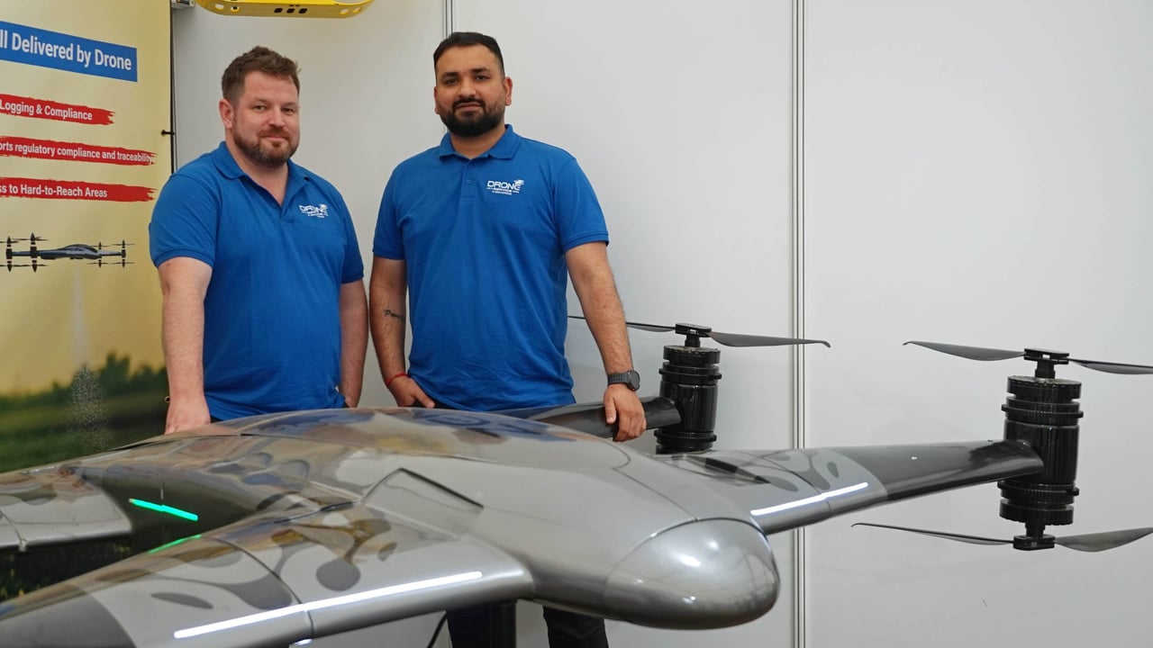Left to right: Simon Henry and Dhairya Bhatt stand alongside the ZD1000 drone