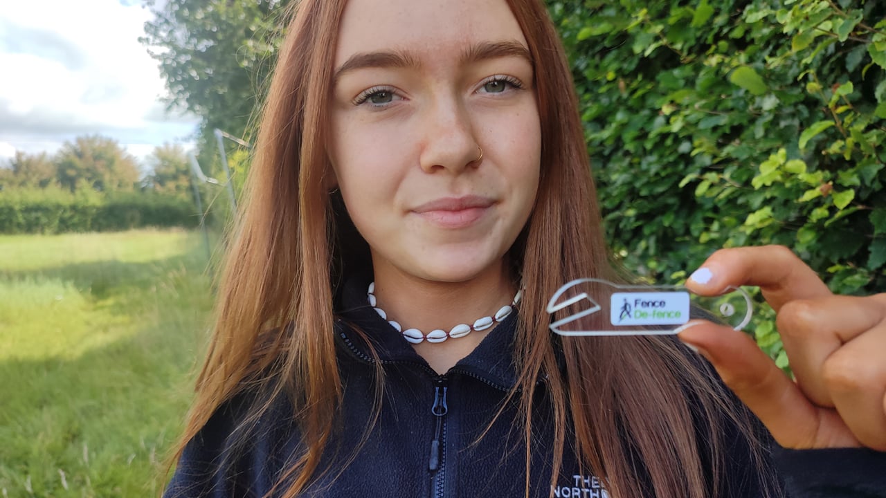 16-year-old Alanna McCabe with her award-winning innovation, Fence De-Fence
