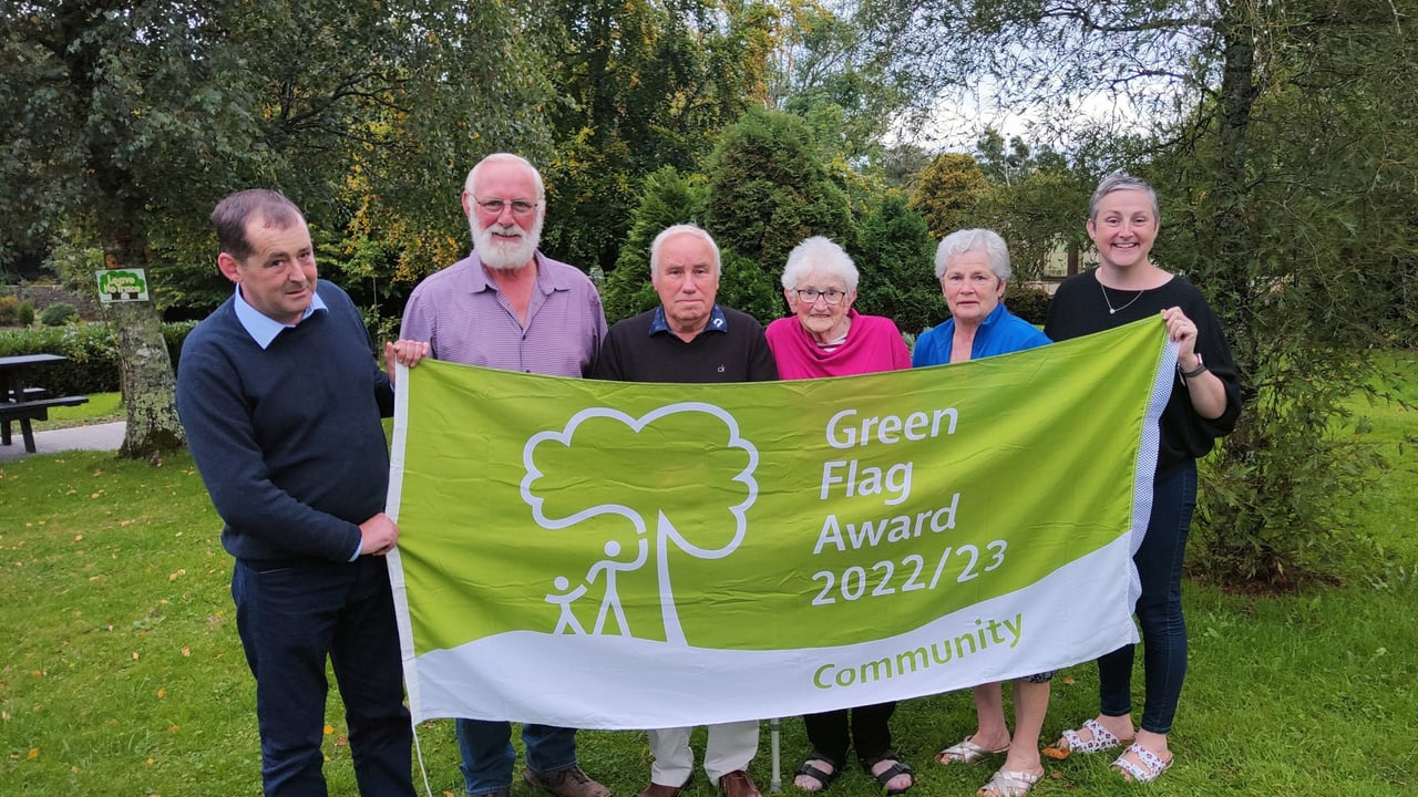 Member of Foulksmills Tidy Towns celebrate winning their first Green Flag Community Award flag