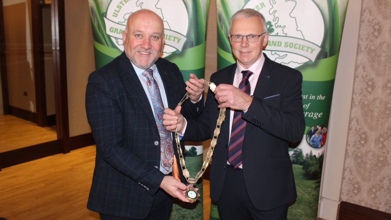 Outgoing UGS president, Colin Linton (left) hands over the chain-of-office to his successor, John Egerton