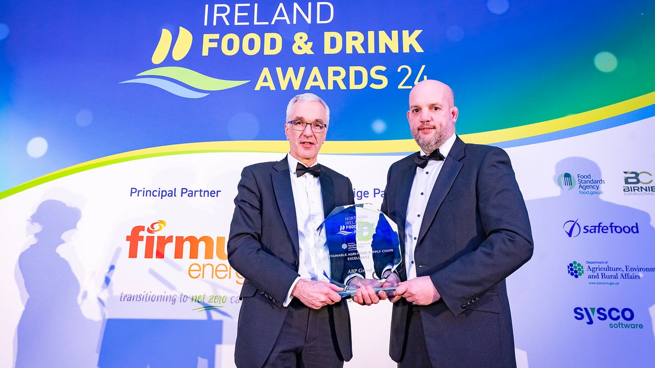 Norman Fulton, Department of Agriculture, Environment and Rural Affairs (DAERA) presenting the award to Gareth Weir on behalf of ABP 