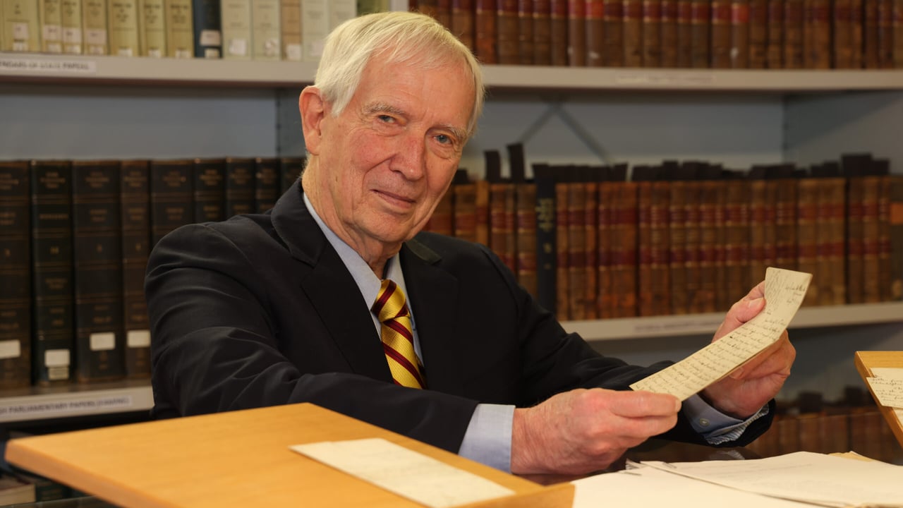 Kerby Miller with materials from his collection in the University of Galway archives and special collections reading room on March 7. Image source: Aengus McMahon.