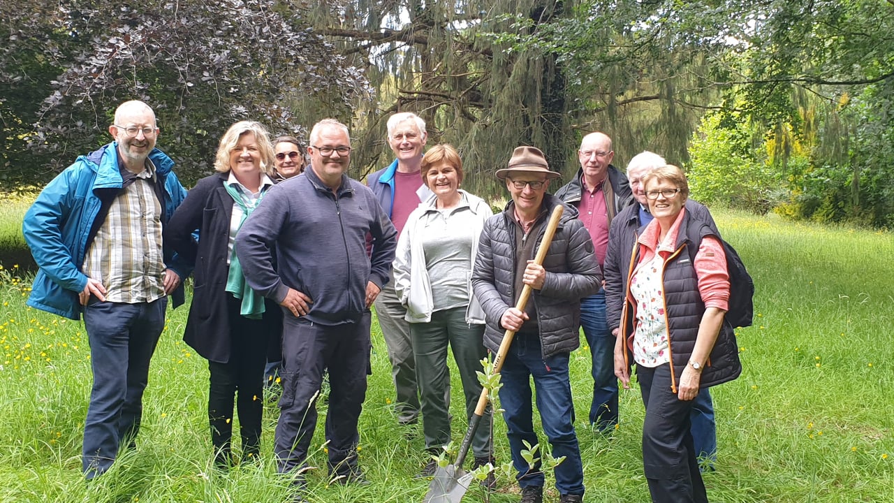 Joe Deering (ITGA), with spade, and Edward Bailey (Head Gardener) plant the native Irish Whitebeam with OPW staff and ITGA members at Emo Court Image source ITGA