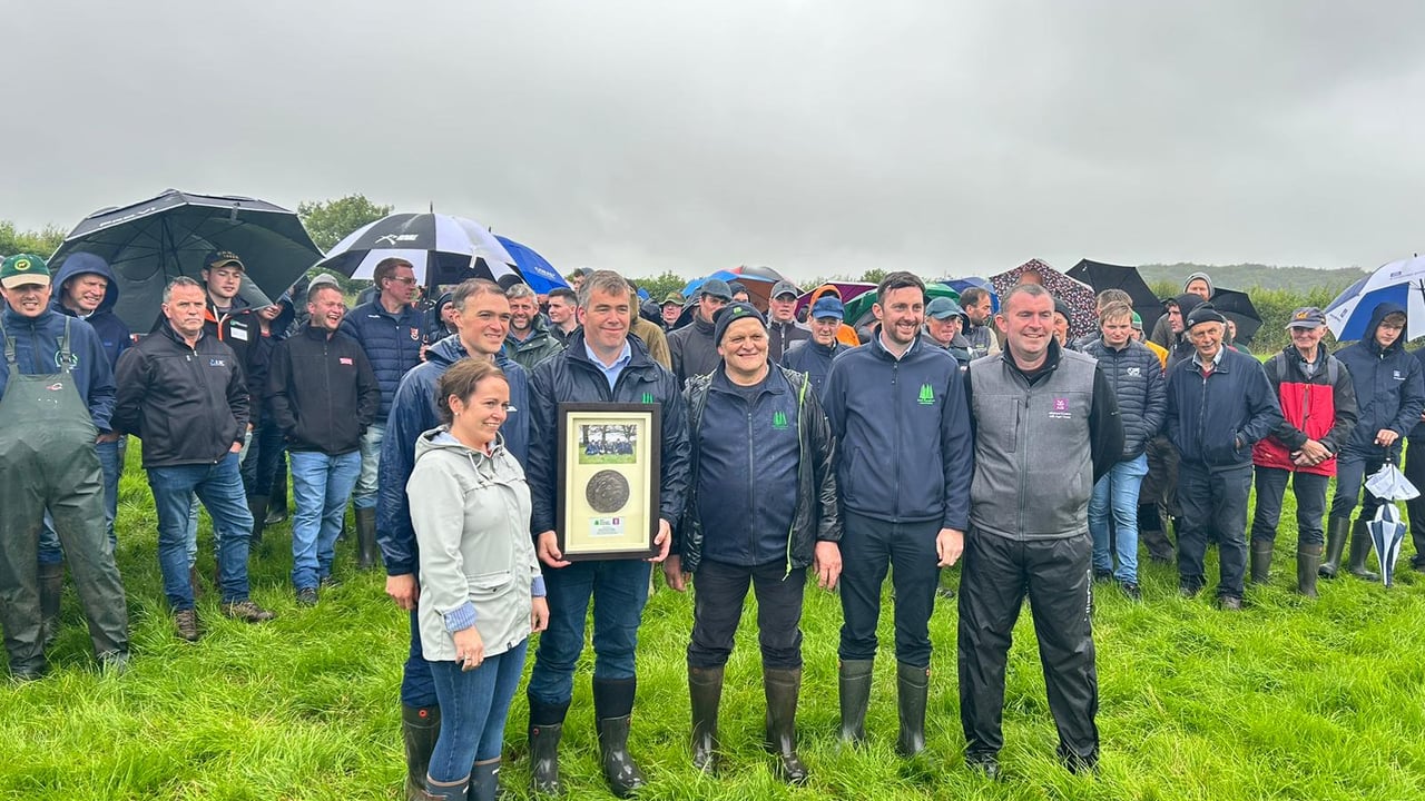 Roy and Trevor Cobbe getting presented with an award for their contribution to the IGA summer tour